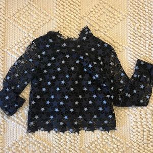 Black top with blue star embellishments